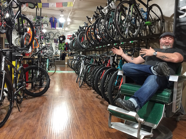 Zen Bikes owner John Keoshgerian surveys his store from the comfort of a recently restored barber chair. Photo by Scott Stiffler.